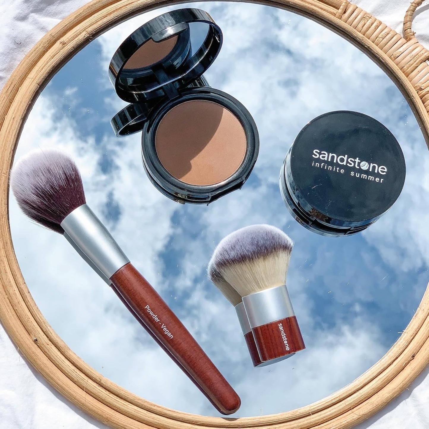 Infinite Summer Bronzer: Luxurious, rich color for a natural summer glow. Allergy tested, vegan, and suitable for sensitive skin. Buildable and blendable.